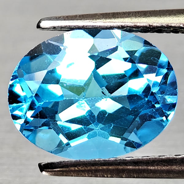 Natural Swiss Blue Topaz 2.47 Ct. Oval Shape 9.1 x 7.1 Mm Gemstone From Brazil: Product ID: 807168134 Product Name: Natural Blue Topaz Weight: 2.47 CT. Size: 9.1 x 7.1 x 5.1 MM. Shape: Oval Shape Color: Swiss Blue Clarity:VVS - VSI Luster: Good Gems Origin: Brazil Treatment: Trea