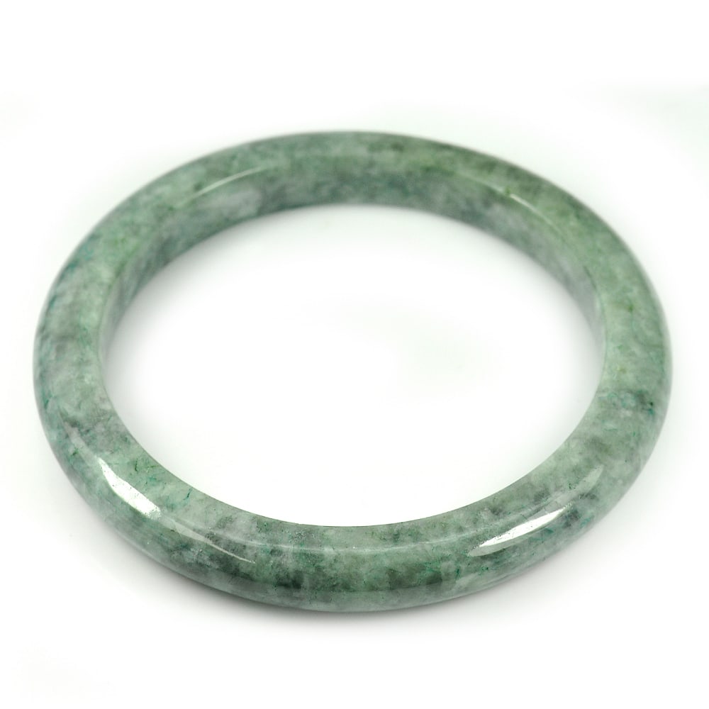 Natural Green Jade Bangle 229.14 Ct. Diameter 59 Mm. Unheated Gemstone: Product ID: 819814903 Product Name: Natural Jade Weight: 229.14 CT. Size: 75 x 59 x 9 MM. Shape: Round Color: Green Clarity:Opaque Luster: Good Gems Origin: Thailand Treatment: Unheated Crystal Struct