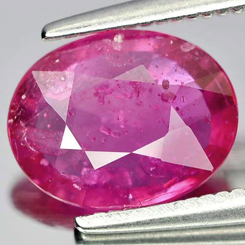Natural Purplish Pink Ruby 1.79 Ct. Oval Shape 9 x 7.1 Mm. Gemstone From Mozambique: Product ID: 805926753 Product Name: Natural Ruby Weight: 1.79 CT. Size: 9 x 7.1 x 2.9 MM. Shape: Oval Color: Purplish Pink Clarity:VSI Luster: Good Gems Origin: Mozambique Treatment: Heated (Lead-glas