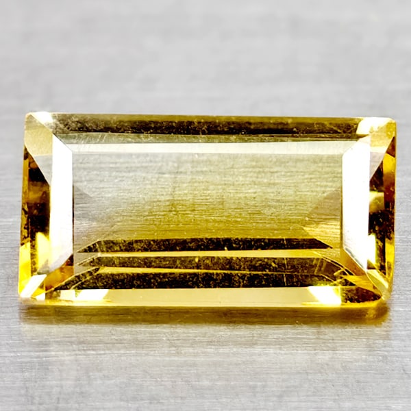 Natural Yellow Citrine 1.42 Ct. Clean Baguette Shape 10.1 x 5.3 Mm Gemstone From Brazil: Product ID: 801815050 Product Name: Natural Citrine Weight: 1.42 CT. Size: 10.1 x 5.3 x 3.4 MM. Shape: Baguette Color: Yellow Clarity:If Luster: Good Gems Origin: Brazil Treatment: Unheated Crystal St