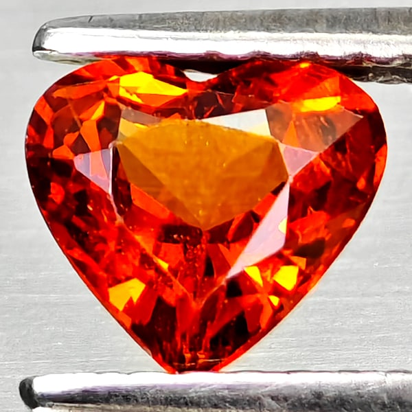 Natural Orangish Red Spessartine Garnet 0.94 Ct Heart Shape 6.2 x 5.7 Mm Gemstone From Namibia: Product ID: 802936802 Product Name: Natural Spessartine Weight: 0.94 CT. Size: 6.2 x 5.7 x 3.4 MM. Shape: Heart Shape Color: Orangish Red Clarity:VSI Luster: Good Gems Origin: Namibia,Africa Treatment