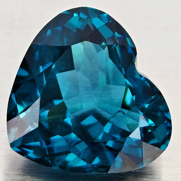 Natural London Blue Topaz 5.74 Ct. Heart Shape 11.9 x 10.5 Mm Gemstone From Brazil: Product ID: 807168367 Product Name: Natural Blue Topaz Weight: 5.74 CT. Size: 11.9 x 10.5 x 6.5 MM. Shape: Heart Shape Color: London Blue Clarity:VVS - VSI Luster: Good Gems Origin: Brazil Treatment: