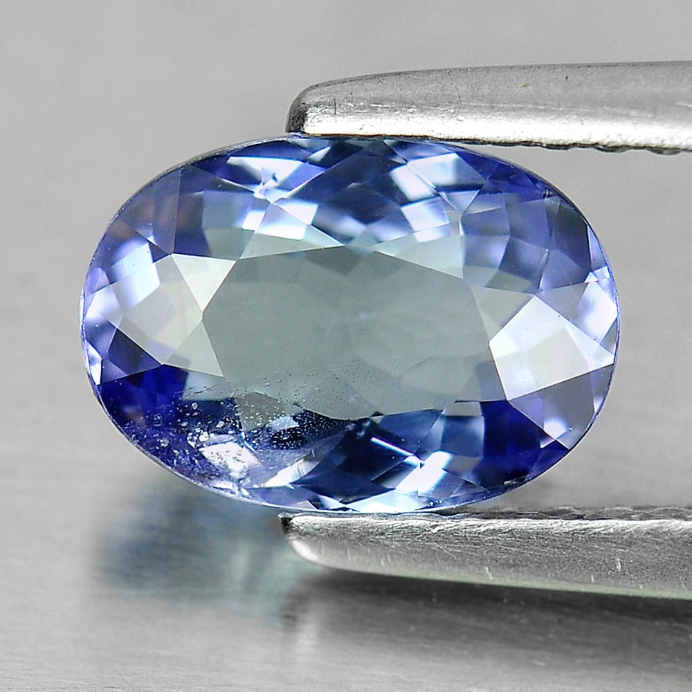 Certified Natural Violet Blue Tanzanite 1.46 Ct. Oval Shape 8.49 x 5.98 Mm Gemstone From Tanzania: Product ID: 807004411 Product Name: Natural Tanzanite Weight: 1.46 CT. Size: 8.49 x 5.98 x 3.59 MM. Shape: Oval Color: Purple Clarity:VSI Luster: Good Gems Origin: Tanzania Treatment: Heated Crystal S