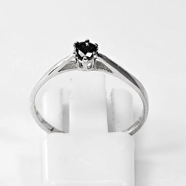 925 Sterling Silver Ring Jewelry 0.82 Grams With Natural Diamond 0.13 Ct. Size 7 From Belgium: Product ID: 502100176 Product Type: 925 Sterling Silver Fine Jewelry Jewelry Weight: 0.82 Grams. Gemstones Color: black Metal: Solid Silver 92.5%. Gemstone Detail: At Your Service: At Treasure of Gems