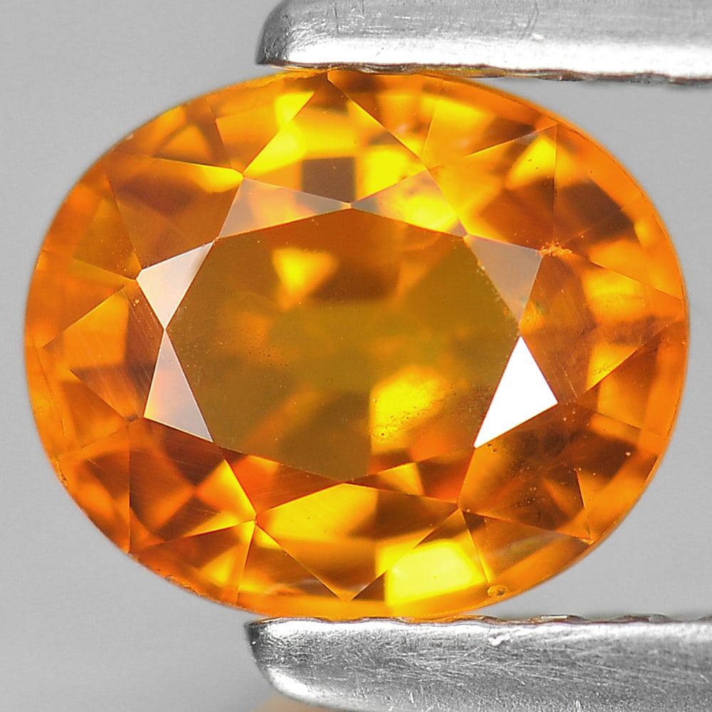 Natural Yellow Sapphire 1.14 Ct. Oval Shape 6.6 x 5.6 Mm. Gemstone From Thailand: Product ID: 806152133 Product Name: Natural Yellow Sapphire Weight: 1.14 CT. Size: 6.6 x 5.6 x 3.6 MM. Shape: Oval Color: Orage Clarity:VSI Luster: Very Good Gems Origin: Thailand Treatment: Heated Cr