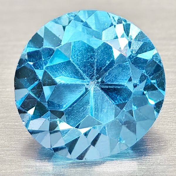 Natural Swiss Blue Topaz 1.34 Ct. Round Shape 6.5 Mm. Gemstone From Brazil: Product ID: 807168117 Product Name: Natural Blue Topaz Weight: 1.34 CT. Size: 6.5 x 6.5 x 5 MM. Shape: Round Shape Color: Swiss Blue Clarity:VSI Luster: Good Gems Origin: Brazil Treatment: Treated Cry