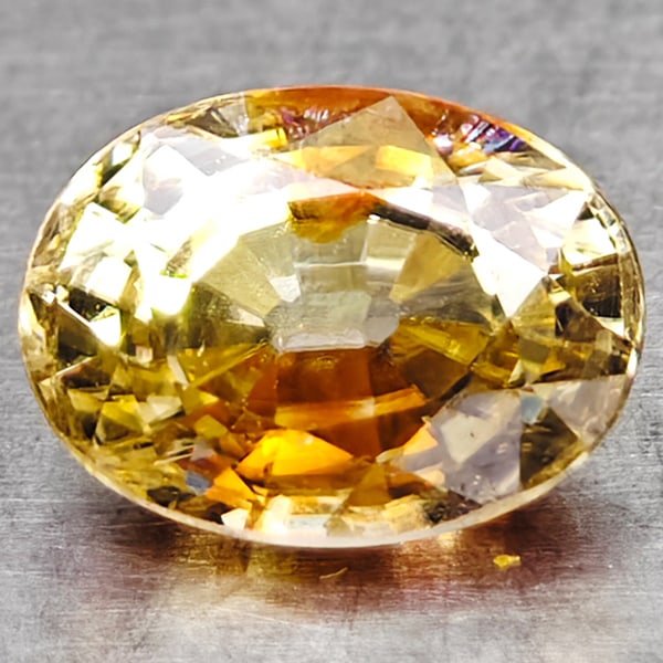 Natural Champagne Zircon 1.60 Ct Oval Shape 5.2 x 7 Mm Gemstone From Cambodia: Product ID: 107701417 Product Name: Natural Zircon Weight: 1.60 CT. Size: 5.2 x 7 x 4 MM. Shape: Oval Color: Party Color Golden Champagne Clarity:VSI Luster: Good Gems Origin: Combodia Treatment: Unhe