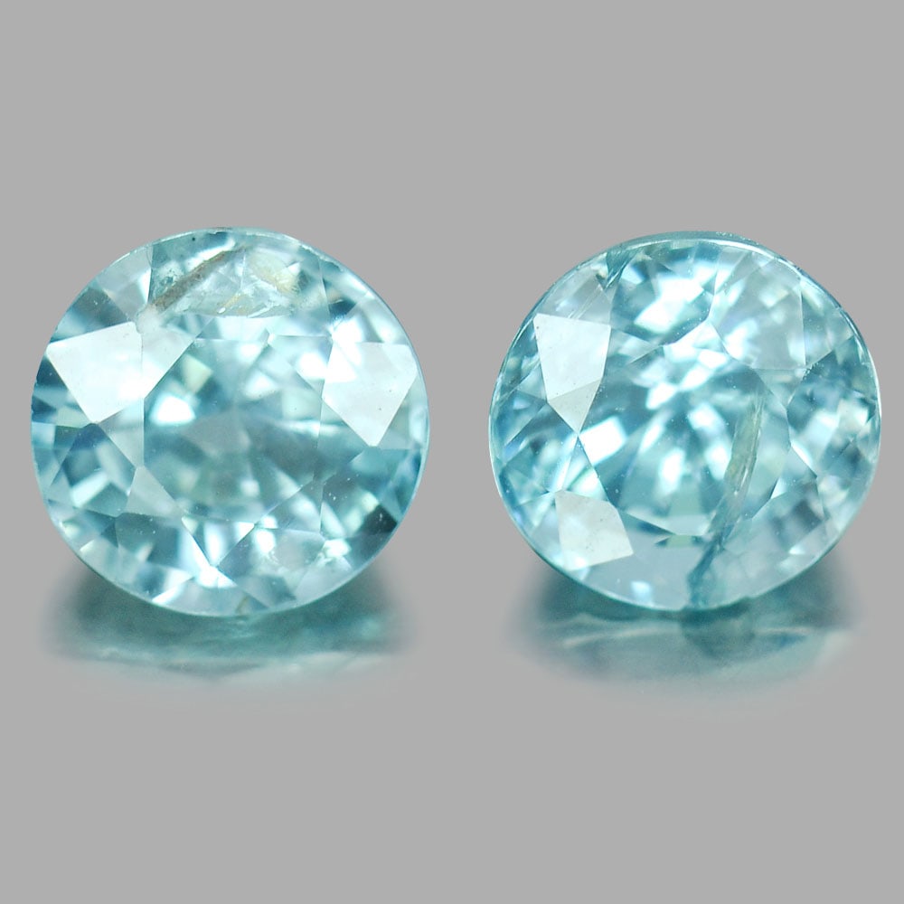 Natural Blue Zircon 3.30 Ct. 2 Pcs. Round Shape 6.2 Mm. Gemstones From Cambodia: Product ID: 807717111 Product Name: Natural Zircon Weight: 3.30 CT. Size: 6.2x4.1,6.2x5 MM. Shape: Round Color: Blue Clarity:SI1 Luster: Good Gems Origin: Cambodia Treatment: Heated Crystal Structure: