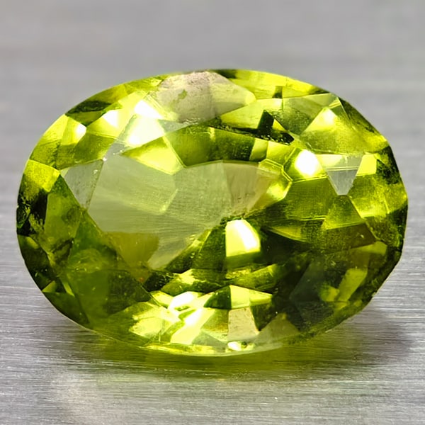 Natural Green Peridot 0.83 Ct. Oval Shape 6.6 x 4.8 Mm Gemstone from Thailand: Product ID: 105300599 Product Name: Natural Peridot Weight: 0.83 CT. Size: 6.6 x 4.8 x 3.3 MM. Shape: Oval Color: Green Clarity:VSI Luster: Good Gems Origin: Thailand Treatment: Unheated Crystal Struc