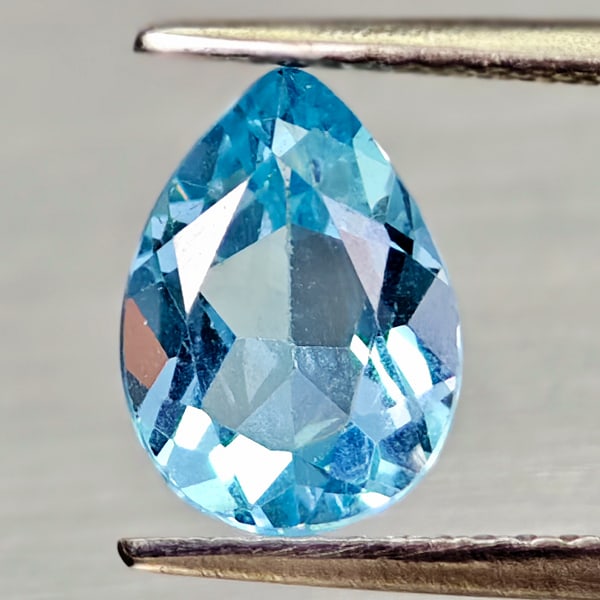 Natural Swiss Blue Topaz 1.94 Ct. Pear Shape 9.4 x 6.9 Mm Gemstone From Brazil: Product ID: 807168014 Product Name: Natural Blue Topaz Weight: 1.94 CT. Size: 9.4 x 6.9 x 4.3 MM. Shape: Pear Shape Color: Swiss Blue Clarity:VSI - SI1 Luster: Good Gems Origin: Brazil Treatment: Trea