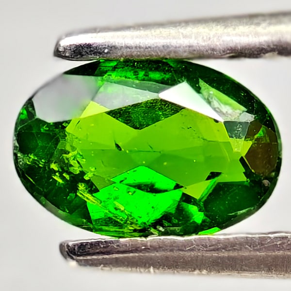 Natural Green Chrome Diopside 0.38 Ct. Oval Shape 6 x 4.1 Mm Gemstone From Russia: Product ID: 801608162 Product Name: Natural Chrome Diopside Weight: 0.38 CT. Size: 6 x 4.1 x 2.1 MM. Shape: Oval Color: Green Clarity:VSI - SI1 Luster: Good Gems Origin: Russia Treatment: Unheated Cry