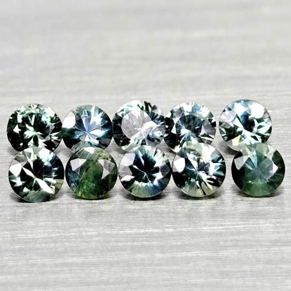 Natural Fancy Color Sapphire 0.87 Ct. 10 Pcs Round Diamand Cut 2.6 Mm Gemstones From Tanzania: Product ID: 806162202 Product Name: Natural Green Sapphire Weight: 0.87 CT. Size: 2.6 x 2.6 x 1.7 MM. Shape: Round Diamond Cut Color: Fancy Color Clarity:VSI Luster: Very Good Gems Origin: Tanzania Tr