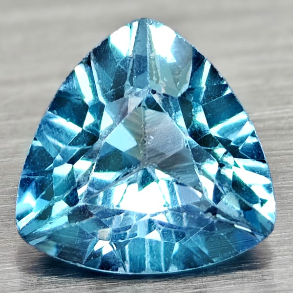 Natural Swiss Blue Topaz 2.98 Ct. Trilliant Shape 9.1 Mm Gemstone From Brazil: Product ID: 807167950 Product Name: Natural Blue Topaz Weight: 2.98 CT. Size: 9.1 x 9.1 x 5.7 MM. Shape: Trilliant Color: Swiss Blue Clarity:VSI Luster: Good Gems Origin: Brazil Treatment: Treated Cry