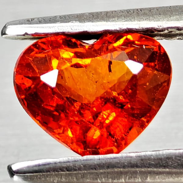 Natural Orangish Red Spessartine Garnet 0.91 Ct. Heart Shape 6.1 x 5.1 Mm. Gemstone From Namibia: Product ID: 802936810 Product Name: Natural Spessartine Weight: 0.91 CT. Size: 6.1 x 5.1 x 3.5 MM. Shape: Heart Shape Color: Orangish Red Clarity:VSI Luster: Good Gems Origin: Namibia,Africa Treatment