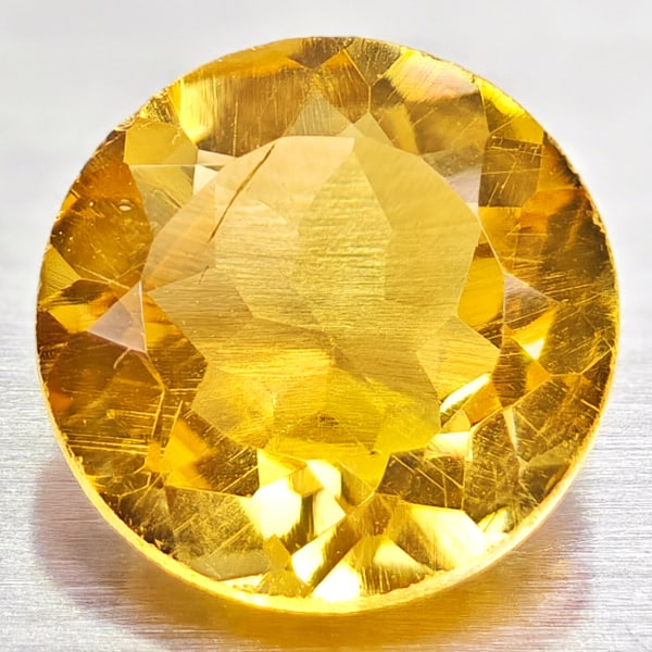 Natural Yellow Citrine 1.03 Ct. VVS Round Shape 7 Mm. Gemstone From Brazil: Product ID: 801813579 Product Name: Natural Citrine Weight: 1.03 CT. Size: 7 x 7 x 3.8 MM. Shape: Round Color: yellow Clarity:VVS Luster: Good Gems Origin: Barzil Treatment: Unheated Crystal Structure