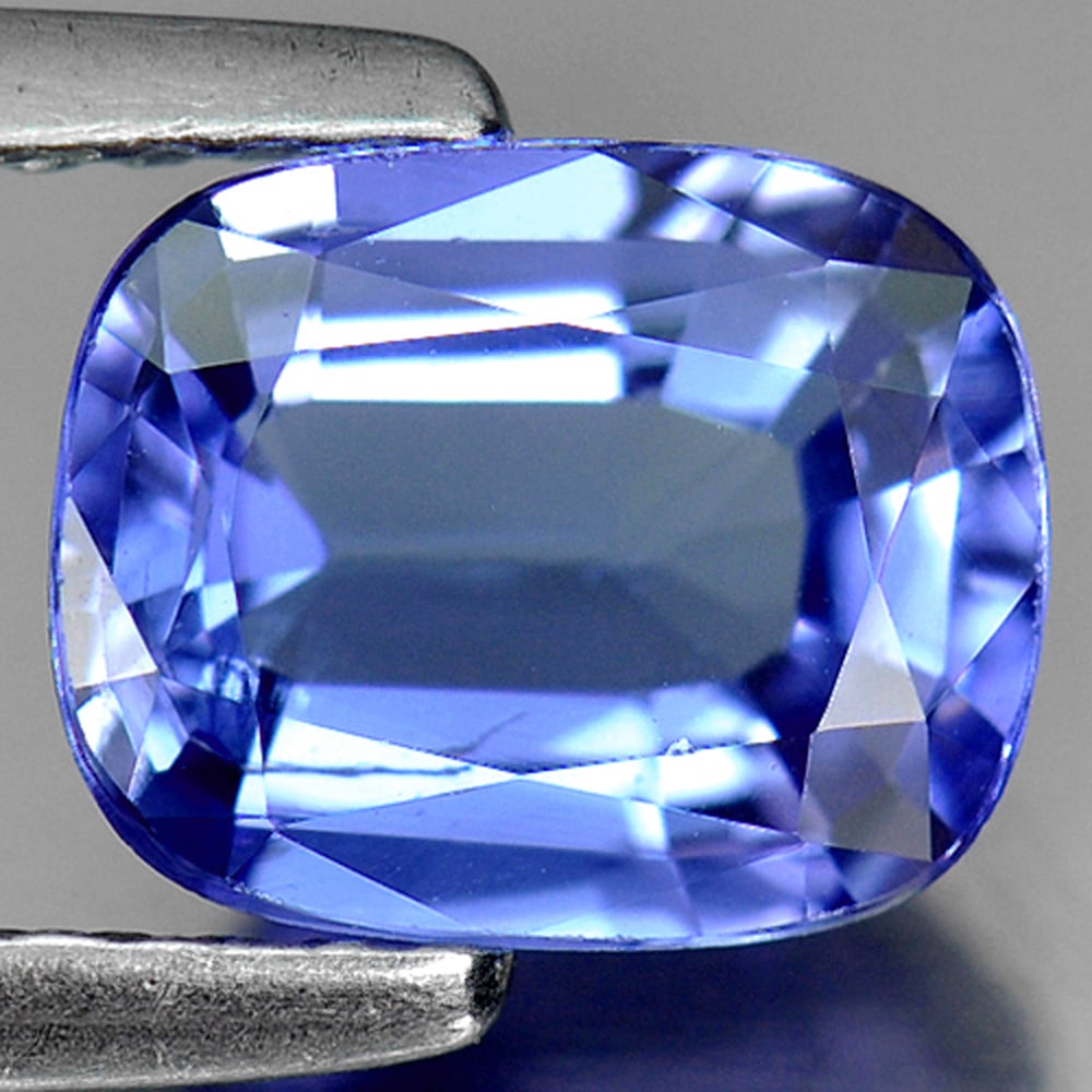 Natural Violetish Blue Tanzanite 1.40 Ct. Cushion Shape 7.7 x 6.2 Mm. Gemstone From Tanzania: Product ID: 807009190 Product Name: Natural Tanzanite Weight: 1.40 CT. Size: 7.7 x 6.2 x 3.4 MM. Shape: Cushion Color: Violetish Blue Clarity:VSI Luster: Very Good Gems Origin: Tanzania Treatment: Hea