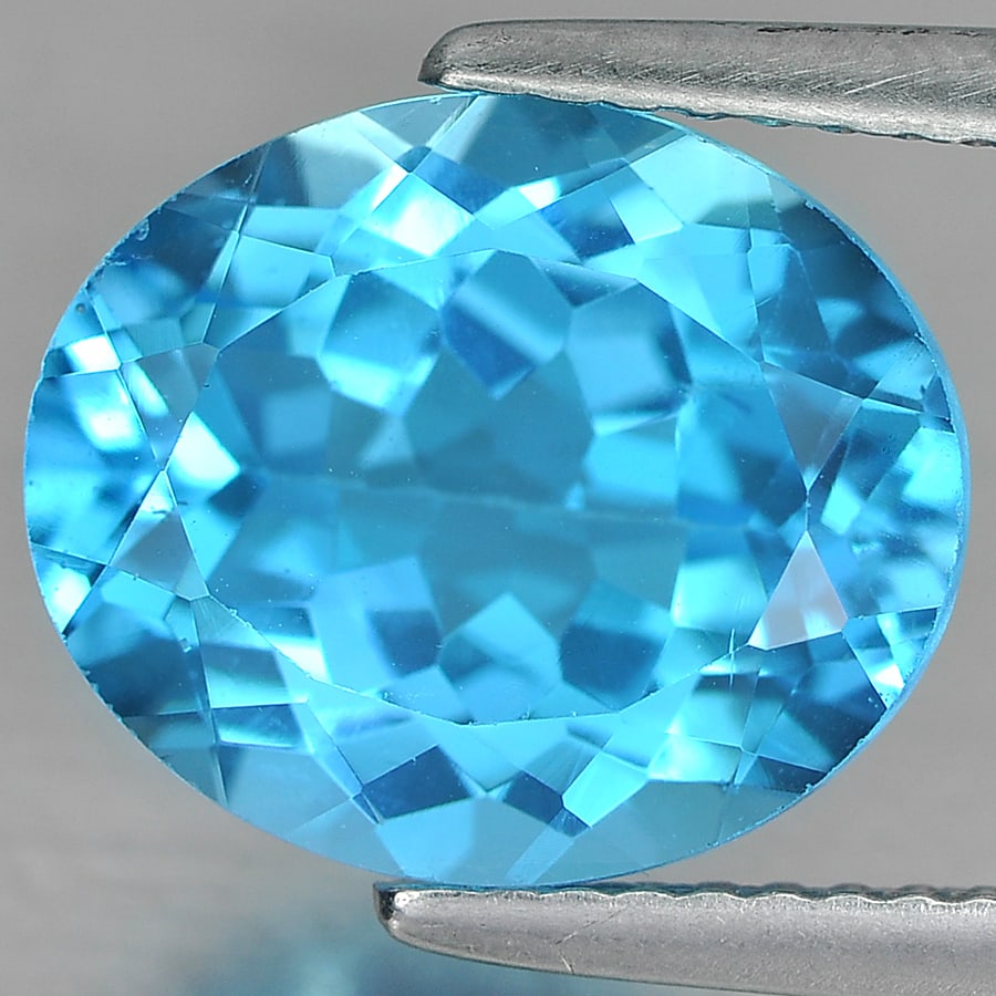 Natural Swiss Blue Topaz 5.62 Ct. VVS Oval Shape 12 x 10 Mm. Gemstone From Brazil: Product ID: 807161061 Product Name: Natural Blue Topaz Weight: 5.62 CT. Size: 12 x 10 x 6.4 MM. Shape: Oval Color: Blue Clarity:VVS Luster: Good Gems Origin: Brazil Treatment: Treated Crystal Structur