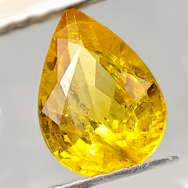 Natural Yellow Sapphire 0.87 Ct. Pear Shape 7.1 x 5.1 Mm Gemstone From Thailand: Product ID: 806162586 Product Name: Natural Yellow Sapphire Weight: 0.87 CT. Size: 7.1 x 5.1 x 3.1 MM. Shape: Pear Shape Color: Yellow Clarity:VSI - SI1 Luster: Good Gems Origin: Thailand Treatment: T