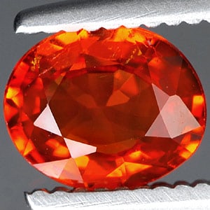 Reddish Orange Spessartine Garnet 0.78 Ct. Oval Shape 6 x 5 Mm. Gemstone from Nigeria: Product ID: 802915174 Product Name: Natural Spessartine Weight: 0.78 CT. Size: 6 x 5 x 2.8 MM. Shape: Oval Color: Reddish Orange Clarity:VSI Luster: Good Gems Origin: Nigeria Treatment: Unheated Cryst