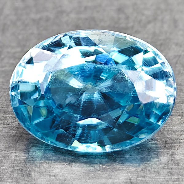 Natural Blue Zircon 1.24 Ct. VVS Oval Shape 6.8 x 5 Mm Gemstone From Cambodia: Product ID: 107706916 Product Name: Natural Zircon Weight: 1.24 CT. Size: 6.8 x 5 x 3.6 MM. Shape: Oval Color: Sky Blue Clarity:VVS Luster: Good Gems Origin: Cambodia Treatment: Heated Crystal Structu
