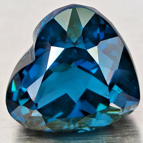 Natural London Blue Topaz 6.18 Ct. Heart Shape 10.6 x 9.5 Mm Gemstone From Brazil: Product ID: 807168376 Product Name: Natural Blue Topaz Weight: 6.18 CT. Size: 10.6 x 9.5 x 8.3 MM. Shape: Heart Shape Color: London Blue Clarity:VVS - VSI Luster: Good Gems Origin: Brazil Treatment: T