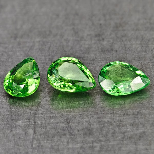 Natural Green Tsavorite Garnet 0.89 Ct. 3 Pcs Pear Shape 5.1 x 4.1 Mm Gemstones From Tanzania: Product ID: 803005011 Product Name: Natural Tsavorite Weight: 0.89 CT. Size: 5.1 x 4.1 x 2.3 MM. Shape: Pear Shape Color: Green Clarity:VSI Luster: Very Good Gems Origin: Tanzania Treatment: Unheated 