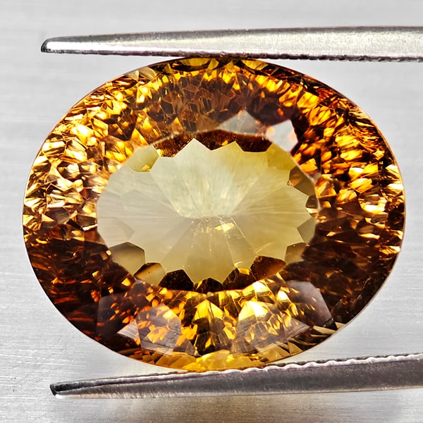 Natural Imperial Topaz 17.11 Ct. Oval Concave Cut 16.5 x 13.6 Mm. Gemstone From Brazil: Product ID: 807168282 Product Name: Natural Topaz Weight: 17.11 CT. Size: 16.5 x 13.6 x 10.1 MM. Shape: Oval Concave Color: Imperial Clarity:VSI Luster: Good Gems Origin: Brazil Treatment: Unheated Cr