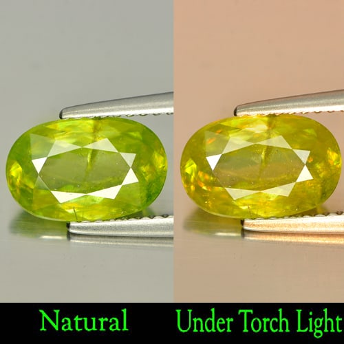 Natural Intense Yellowish Green Titanium Sphene 2.07 Ct. Oval Shape 10.5 x 6.8 Mm. Gemstone: Product ID: 806506023 Product Name: Natural Sphene Weight: 2.07 CT. Size: 10.5 x 6.8 x 3.6 MM. Shape: Oval Color: Intense Yellowish Green Titanium With Rainbow Clarity:SI Luster: Adamantine Gems Origi