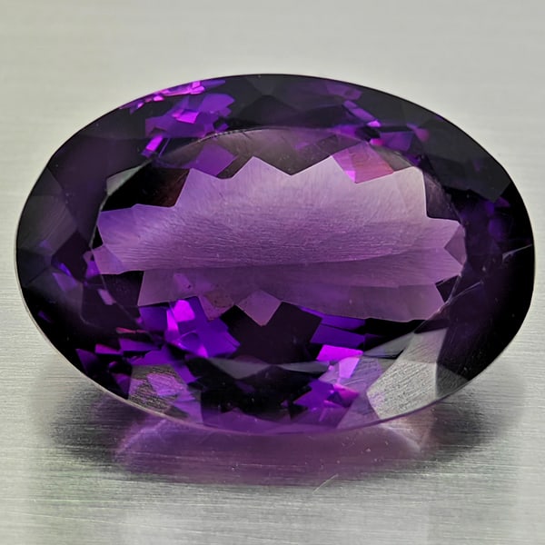 Natural Purple Amethyst 27.35 Ct. Oval Shape 23 x 16 Mm Gemstone from Brazil: Product ID: 800325505 Product Name: Natural Amethyst Weight: 27.35 CT. Size: 23 x 16 x 12.7 MM. Shape: Oval Color: Purple Clarity:VSI Luster: Good Gems Origin: Brazil Treatment: Unheated Crystal Struc