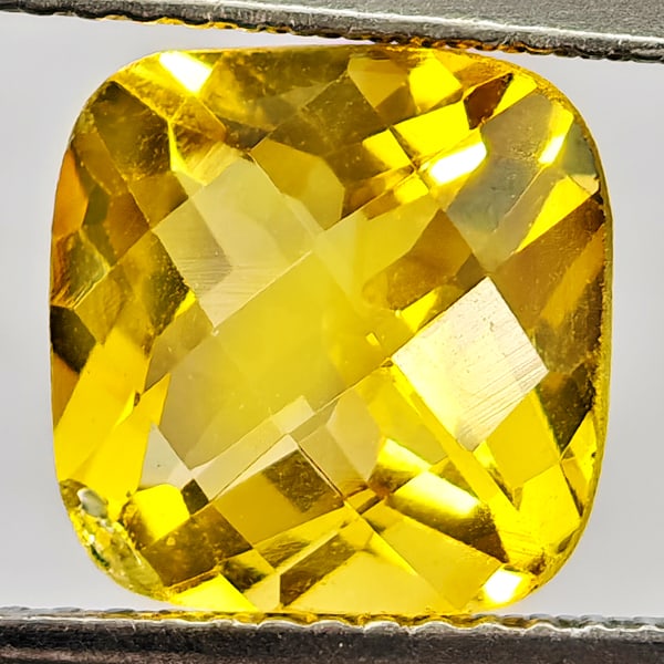 Natural Yellow Citrine 3.11 Ct. Cushion Checkerboard Cut 9.3 Mm. Gemstone From Brazil: Product ID: 801815150 Product Name: Natural Citrine Weight: 3.11 CT. Size: 9.3 x 9.3 x 6.2 MM. Shape: Cushion Checkerboard Cut Color: Yellow Clarity:VVS - VSI Luster: Good Gems Origin: Brazil Treatmen