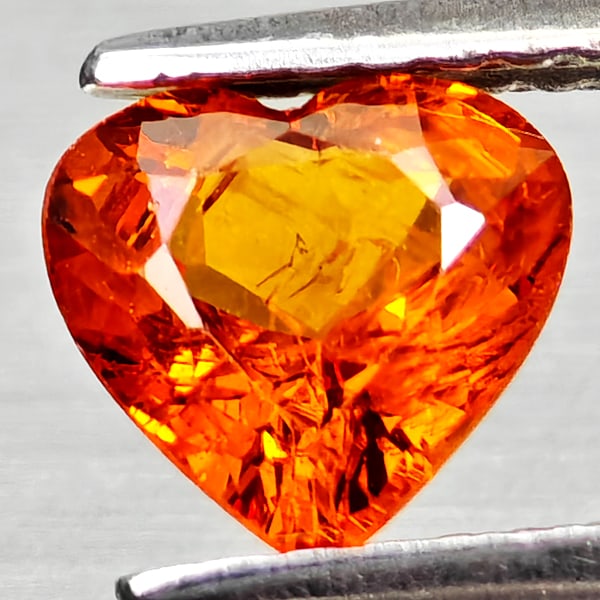 Natural Orangish Red Spessartine Garnet 0.91 Ct Heart Shape 6.3 x 6 Mm Gemstone From Namibia: Product ID: 802936807 Product Name: Natural Spessartine Weight: 0.91 CT. Size: 6.3 x 6 x 3.2 MM. Shape: Heart Shape Color: Orangish Red Clarity:VSI Luster: Good Gems Origin: Namibia,Africa Treatment: 