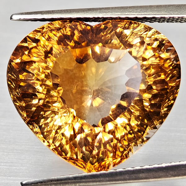 Natural Imperial Topaz 19.47 Ct. Heart Concave Cut 16.9 x 15 Mm Gemstone From Brazil: Product ID: 807168297 Product Name: Natural Topaz Weight: 19.47 CT. Size: 16.9 x 15 x 11 MM. Shape: Heart Concave Color: Imperial Clarity:VSI Luster: Good Gems Origin: Brazil Treatment: Unheated Cryst