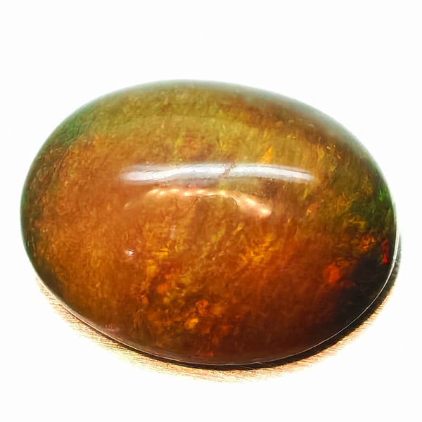 Natural Multi-Color Opal 1.30 Ct. Oval Cabochon Shape 9 x 6.8 Mm Gemstone from Ethiopia: Product ID: 818728031 Product Name: Natural Opal Weight: 1.30 CT. Size: 9 x 6.8 x 3.5 MM. Shape: Oval Cabochon Color: Multi-Color Clarity:Semi - Transparent Luster: Iridescent Gems Origin: Ethiopia Tr