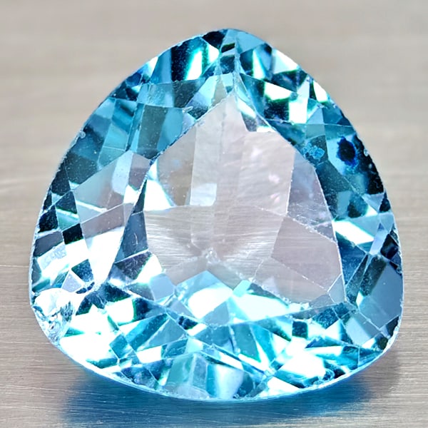 Natural Swiss Blue Topaz 3.85 Ct. Trilliant Shape 10 Mm Gemstone From Brazil: Product ID: 807167955 Product Name: Natural Blue Topaz Weight: 3.85 CT. Size: 10 x 10 x 5.4 MM. Shape: Trilliant Color: Swiss Blue Clarity:VSI Luster: Good Gems Origin: Brazil Treatment: Treated Cryst