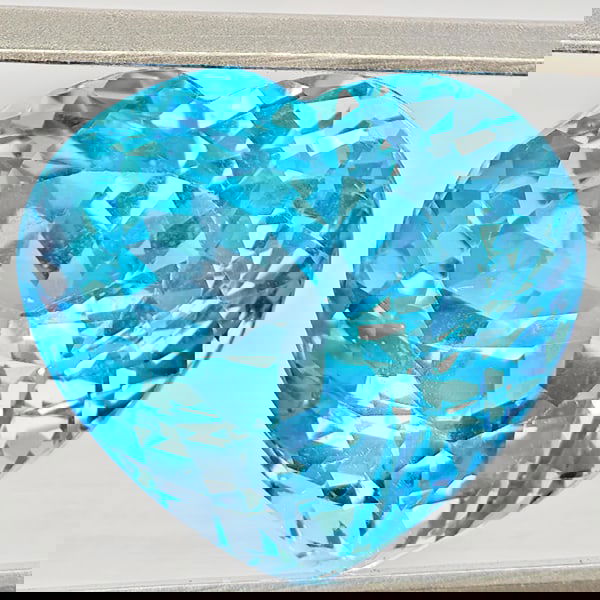 Natural Baby Blue Color Topaz 17.14 Ct. Heart Shape 15.4 x 13.8 Mm Gemstone From Brazil: Product ID: 807168484 Product Name: Natural Blue Topaz Weight: 17.14 CT. Size: 15.4 x 13.8 x 11.4 MM. Shape: Heart Shape Color: Baby Blue Color Clarity:VVS Luster: Very Good Gems Origin: Brazil Treatm