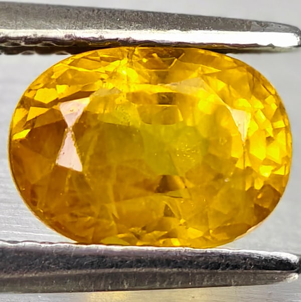 Natural Yellow Sapphire 1.55 Ct. Oval Shape 7.2 x 5.2 Mm Gemstone From Thailand: Product ID: 806162566 Product Name: Natural Yellow Sapphire Weight: 1.55 CT. Size: 7.2 x 5.2 x 4.4 MM. Shape: Oval Color: Yellow Clarity:VSI - SI1 Luster: Good Gems Origin: Thailand Treatment: Heated 