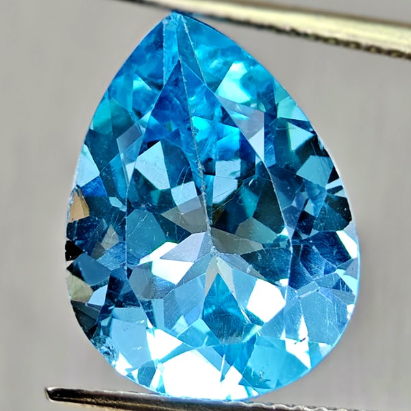 Natural Swiss Blue Topaz 8.53 Ct. Pear Shape 16 x 12.1 Mm Gemstone from Brazil: Product ID: 807167904 Product Name: Natural Blue Topaz Weight: 8.53 CT. Size: 16 x 12.1 x 7.1 MM. Shape: Pear Shape Color: Swiss Blue Clarity:VSI Luster: Good Gems Origin: Brazil Treatment: Treated Cr
