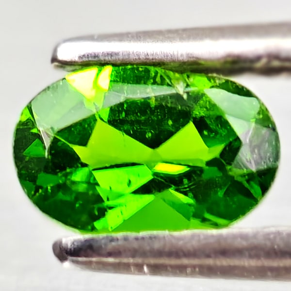 Natural Green Chrome Diopside 0.45 Ct. Oval Shape 6 x 4 Mm Gemstone From Russia: Product ID: 801608196 Product Name: Natural Chrome Diopside Weight: 0.45 CT. Size: 6 x 4 x 2.6 MM. Shape: Oval Color: Green Clarity:VSI - SI1 Luster: Good Gems Origin: Russia Treatment: Unheated Cryst