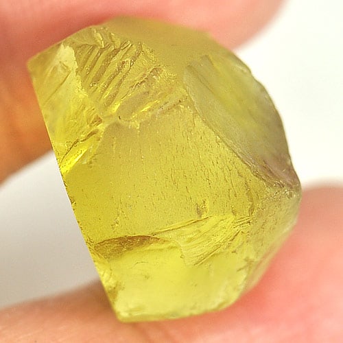Natural Yellow Quartz Rough 28.01 Ct. Unheated Gemstone From Brazil: Product ID: 805523951 Product Name: Natural Rough Weight: 28.01 CT. Size: 21 x 19 x 10.7 MM. Shape: Rough Color: Yellow Clarity:Semi - Transparent Luster: Good Gems Origin: Brazil Treatment: Unheated