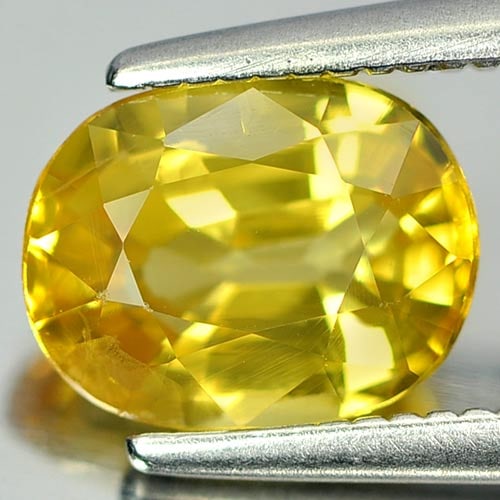 Natural Yellow Sapphire 1.66 Ct. Oval Shape 7.7 x 6 x 4 Mm. Gemstone From Thailand: Product ID: 806151861 Product Name: Natural Yellow Sapphire Weight: 1.66 CT. Size: 7.7 x 6 x 4 MM. Shape: Oval Color: Yellow Clarity:VSI Luster: Very Good Gems Origin: Thailand Treatment: Heated Cryst