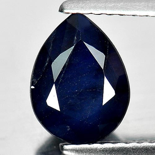 Natural Deep Blue Diffusion Sapphire 1.95 Ct. Pear Shape 9 x 7 Mm Gemstone From Madagascar: Product ID: 806011552 Product Name: Natural Blue Sapphire Weight: 1.95 CT. Size: 9 x 7 x 4 MM. Shape: Pear Color: Deep Blue Clarity:Opaque Luster: Good Gems Origin: Madagascar Treatment: Diffusion Tre