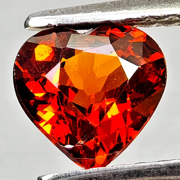 Natural Orangish Red Spessartine Garnet 0.97 Ct Heart Shape 6 x 5.7 Mm Gemstone From Namibia: Product ID: 802936809 Product Name: Natural Spessartine Weight: 0.97 CT. Size: 6 x 5.7 x 3.3 MM. Shape: Heart Shape Color: Orangish Red Clarity:VSI Luster: Good Gems Origin: Namibia,Africa Treatment: 