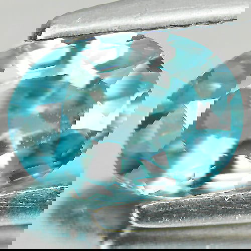 Natural Blue Zircon 1.17 Ct. Oval Shape 7 x 5 Mm. Gemstone From Cambodia: Product ID: 807719905 Product Name: Natural Zircon Weight: 1.17 CT. Size: 7 x 5 x 3 MM. Shape: Oval Color: Blue Clarity:VSI Luster: Good Gems Origin: Cambodia Treatment: Heated Crystal Structure: Tetr