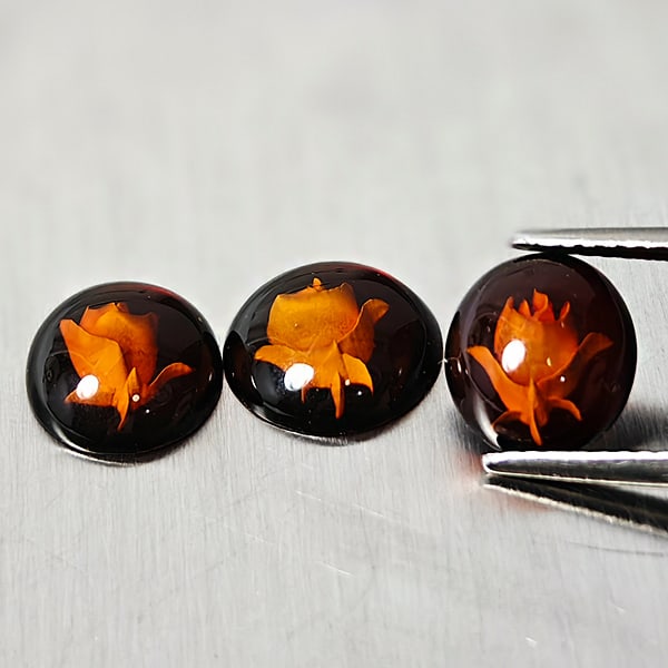 Natural Amber 1.86 Ct. 3 Pcs. Carving With Flowers Three Dimensional Gemstones From Poland: Product ID: 819091023 Product Name: Natural Amber Weight: 1.86 CT. Size: 9.2 x 8.2 x 3.1 MM. Shape: Oval Cabochon Color: Brown Yellow Clarity:None Luster: Good Gems Origin: Poland Treatment: Unheated 