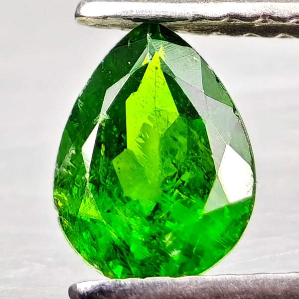 Natural Green Chrome Diopside 0.75 Ct. Pear Shape 7 x 5.2 Mm Gemstone From Russia: Product ID: 801608209 Product Name: Natural Chrome Diopside Weight: 0.75 CT. Size: 7 x 5.2 x 3.3 MM. Shape: Pear Shape Color: Green Clarity:VSI - SI1 Luster: Good Gems Origin: Russia Treatment: Unheat