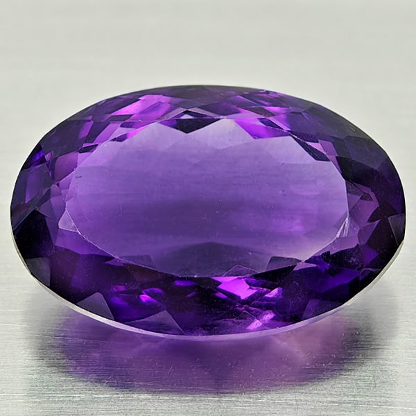 Natural Purple Amethyst 18.55 Ct. Oval Shape 20 x 13.8 Mm Gemstone from Brazil: Product ID: 800325502 Product Name: Natural Amethyst Weight: 18.55 CT. Size: 20 x 13.8 x 9.5 MM. Shape: Oval Color: Purple Clarity:VSI Luster: Good Gems Origin: Brazil Treatment: Unheated Crystal Stru