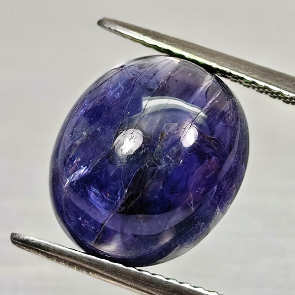 Natural Blue Purple Diffusion Sapphire 7.01 Ct. Oval Cabochon Shape 12.8 x 11.2 Mm Gemstone: Product ID: 806012033 Product Name: Natural Blue Sapphire Weight: 7.01 CT. Size: 12.8 x 11.2 x 6.8 MM. Shape: Oval Cabochon Color: Blue Purple Clarity:Opaque Luster: Good Gems Origin: Madagascar Treat