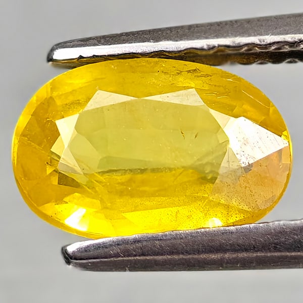 Natural Yellow Sapphire 1.25 Ct. Oval Shape 8 x 5.5 Mm Gemstone From Thailand: Product ID: 806162556 Product Name: Natural Yellow Sapphire Weight: 1.25 CT. Size: 8 x 5.5 x 3 MM. Shape: Oval Color: Yellow Clarity:VSI - SI1 Luster: Good Gems Origin: Thailand Treatment: Heated Crys
