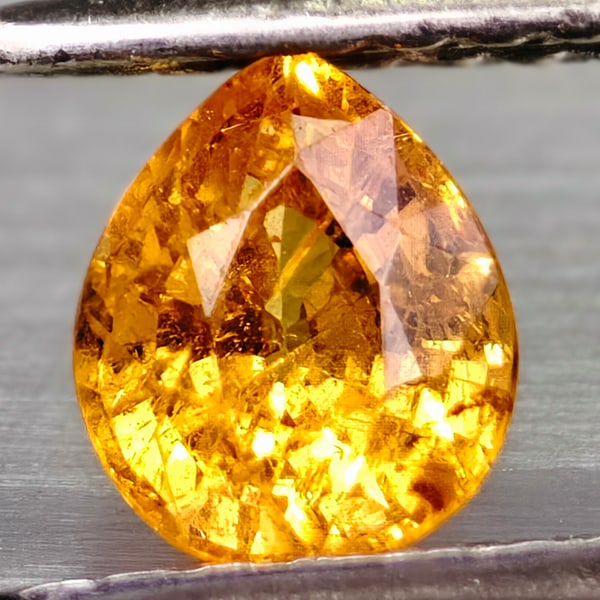 Natural Fanta Orange Spessartine Garnet 0.64 Ct. Pear Shape 5.3 x 4.4 Mm Gemstone from Madagascar: Product ID: 102906950 Product Name: Natural Weight: 0.64 CT. Size: 5.3 X 4.4 X 3.2 MM. Shape: PEAR Color: FANTA ORANGE Clarity:VSI Luster: GOOD Gems Origin: MADAGASCAR Treatment: UNHEATED Crystal Stru