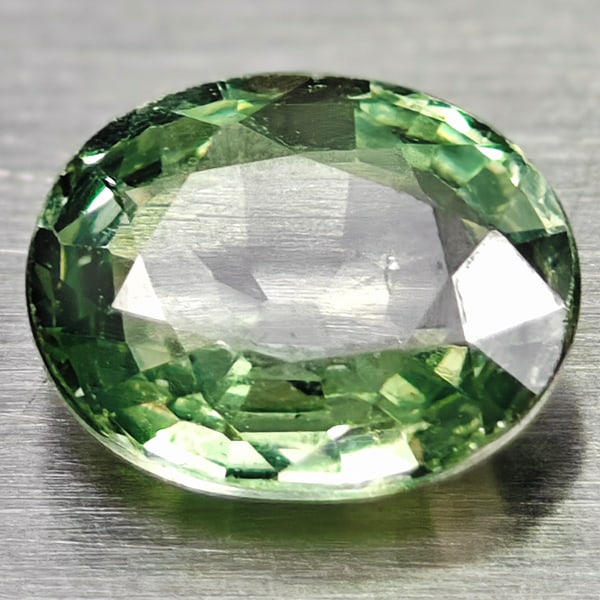 Natural Green Sapphire 0.59 Ct. Oval Shape 5.7 x 4.7 Mm. Gemstone From Thailand: Product ID: 106116247 Product Name: Natural Green Sapphire Weight: 0.59 CT. Size: 5.7 x 4.7 x 2.4 MM. Shape: Oval Color: Green Clarity:IF Luster: Good Gems Origin: Thailand Treatment: Warm Crystal Str